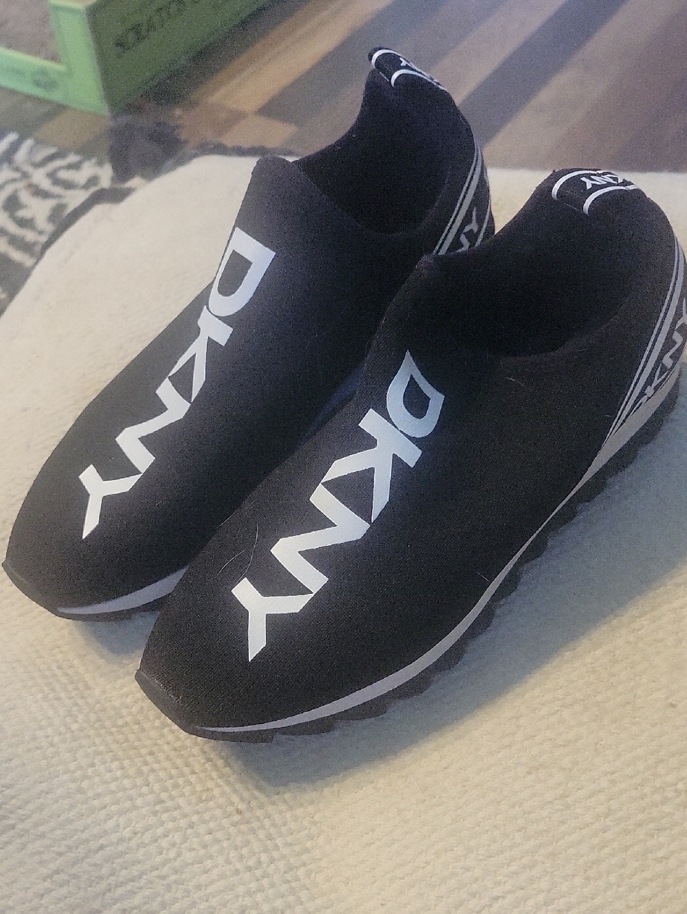 DKNY Black Knit Slip-On Sneakers with White Logo